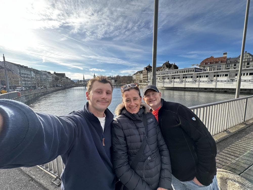 Jonah and two others taking a selfie in front of a canal