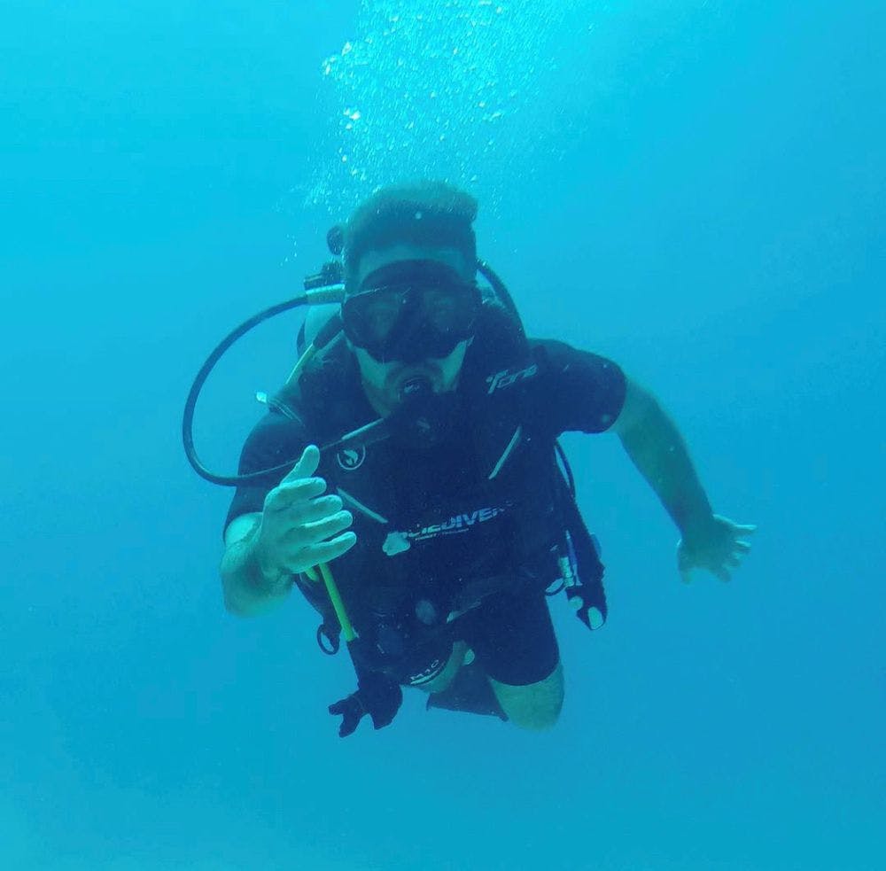 Baqar in scuba gear under water