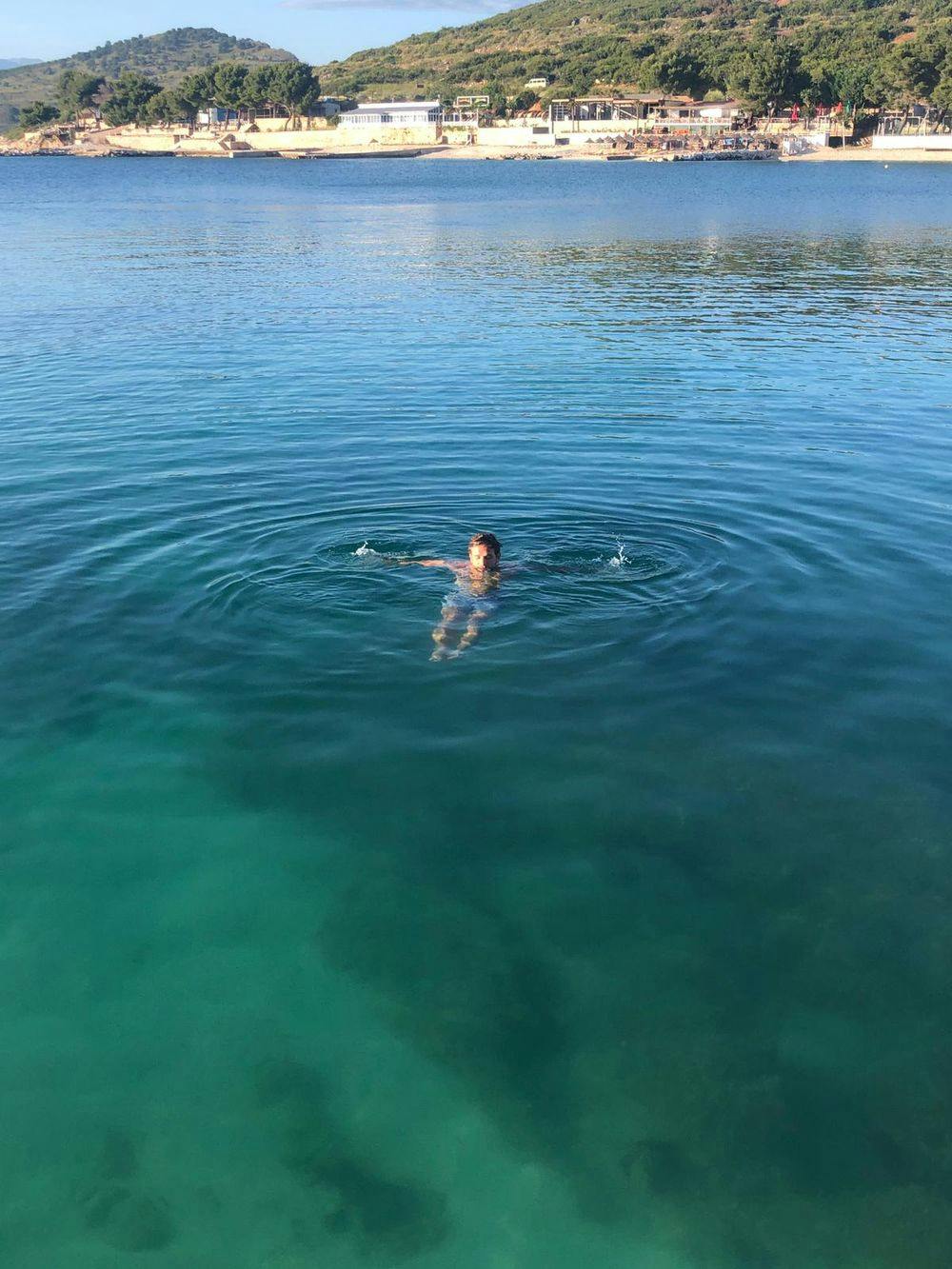 Marc Espada swimming in blue green water